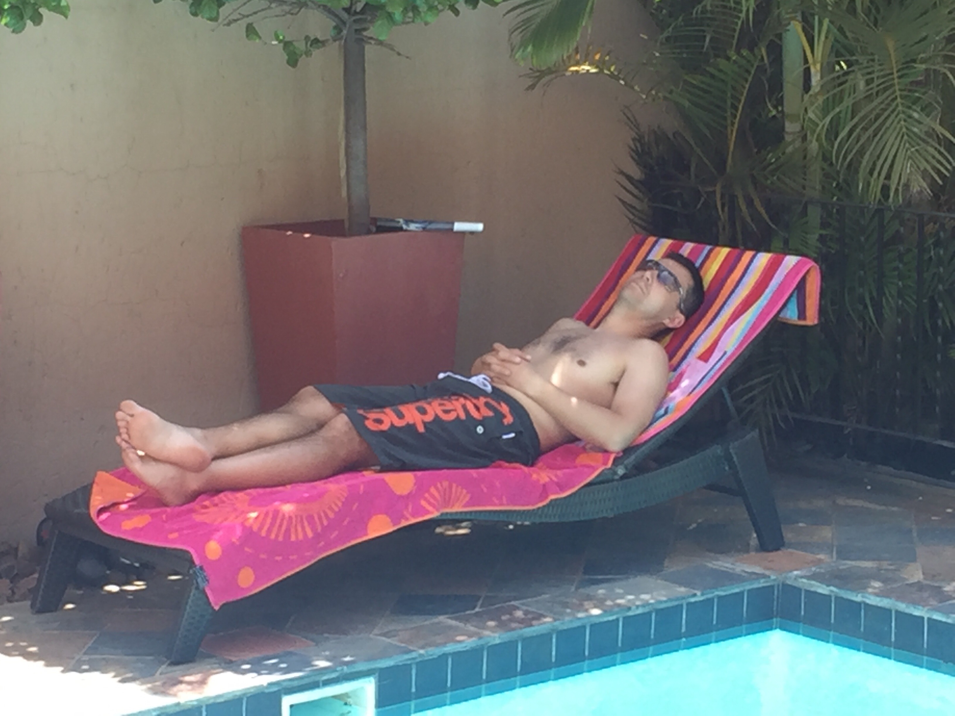 suntanning next to the pool