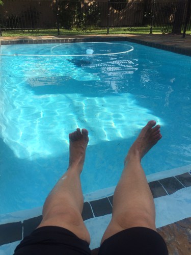 feet  dipping in to the pool